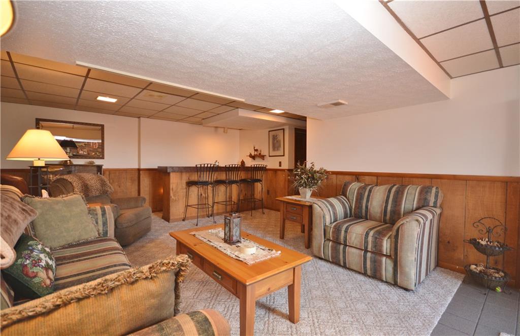 296 Ewings Mill Road Coraopolis, PA 15108 - Photo 12 of 19 Lower level game room with built-in bar. Storage room directly behind bar once featured refrigerator for draft beer.