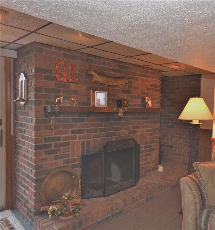 296 Ewings Mill Road Coraopolis, PA 15108 - Photo 15 of 19 Brick log-burning fireplace with nook for wood storage to right.