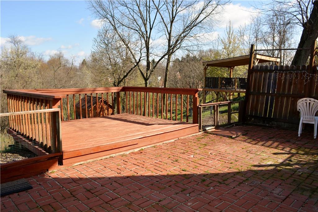 296 Ewings Mill Road Coraopolis, PA 15108 - Photo 16 of 19 Brick patio with deck beyond.