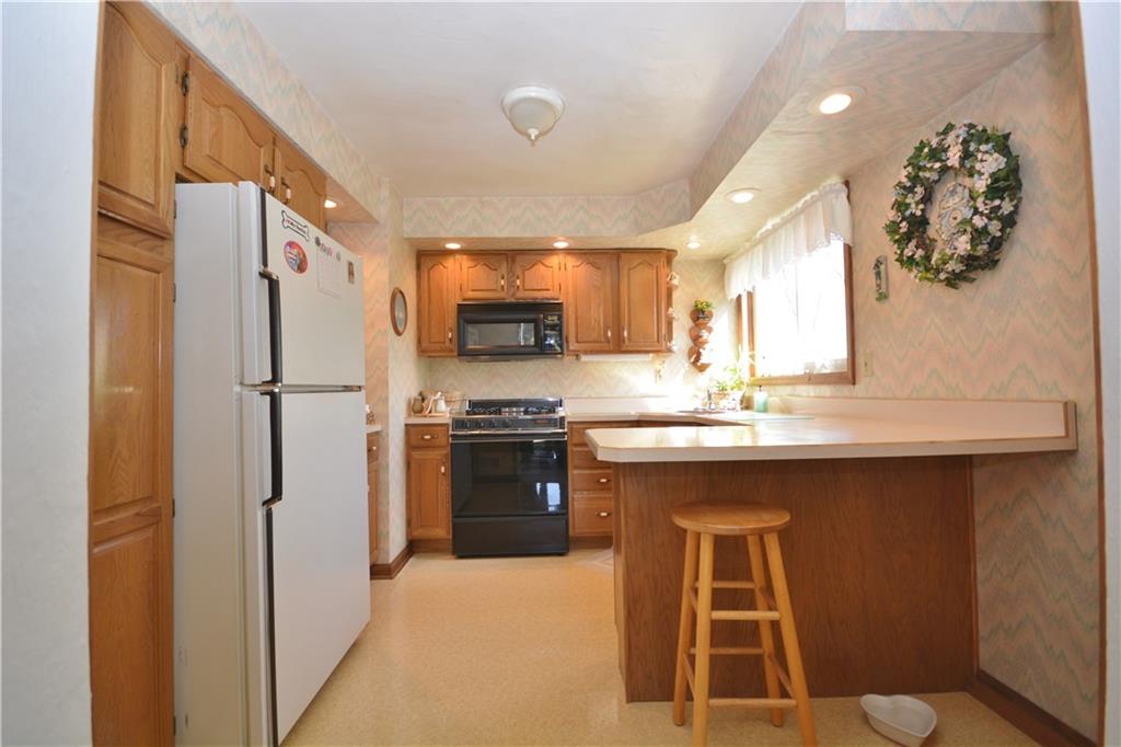 296 Ewings Mill Road Coraopolis, PA 15108 - Photo 5 of 19 Lovely updated kitchen with breakfast bar.