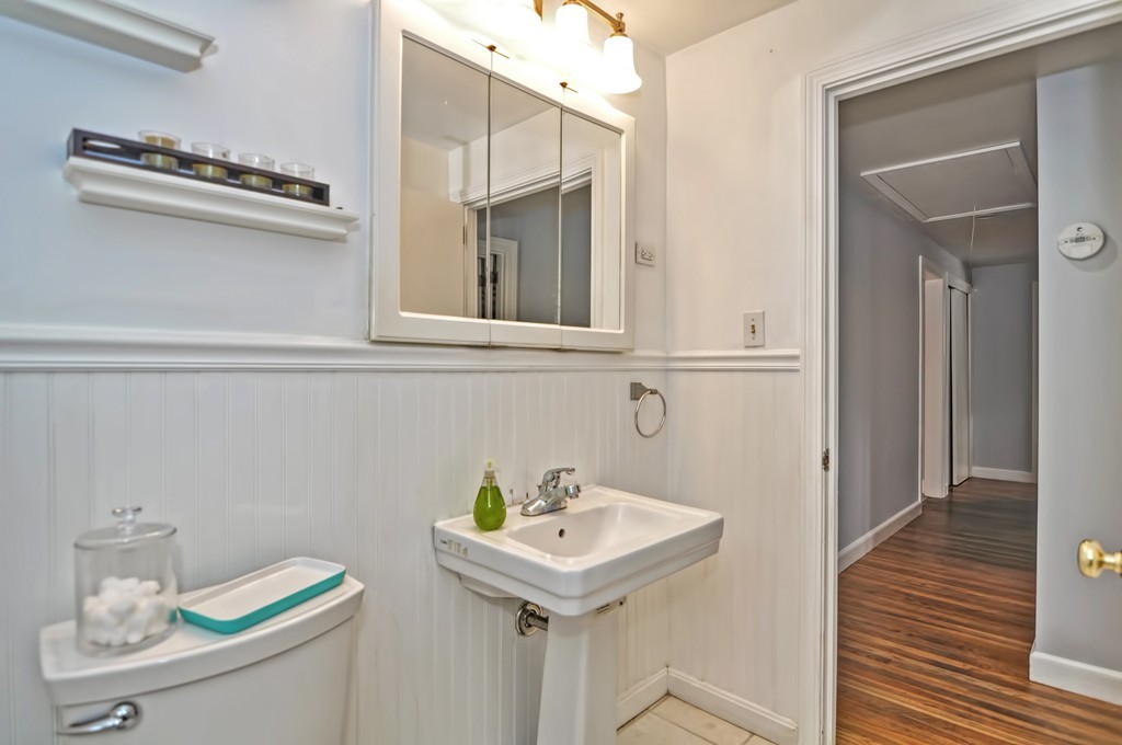 406 Potter Road Framingham, MA 01701 - Photo 20 of 30 a bathroom with a sink a toilet and vanity