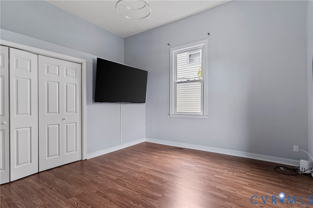 166 Wright Avenue Colonial Heights, VA 23834 - Photo 11 of 36 a view of a livingroom with wooden floor and a flat screen tv