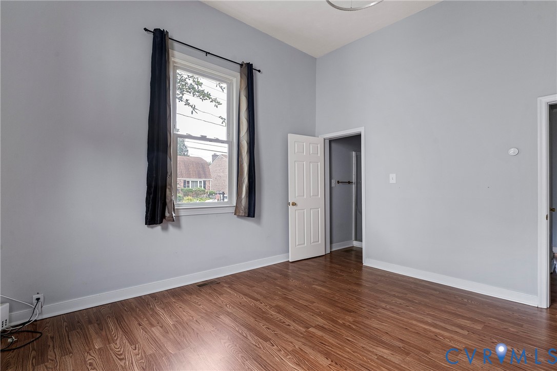 166 Wright Avenue Colonial Heights, VA 23834 - Photo 12 of 36 a view of an empty room with wooden floor and a window