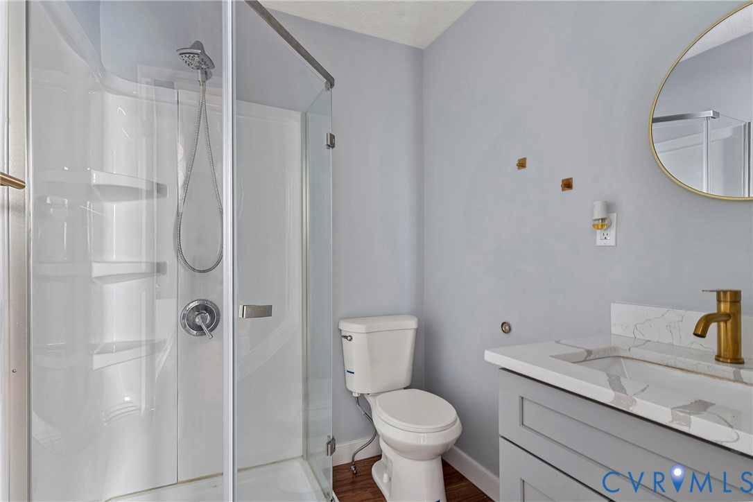 166 Wright Avenue Colonial Heights, VA 23834 - Photo 14 of 36 a bathroom with a granite countertop sink a toilet and shower