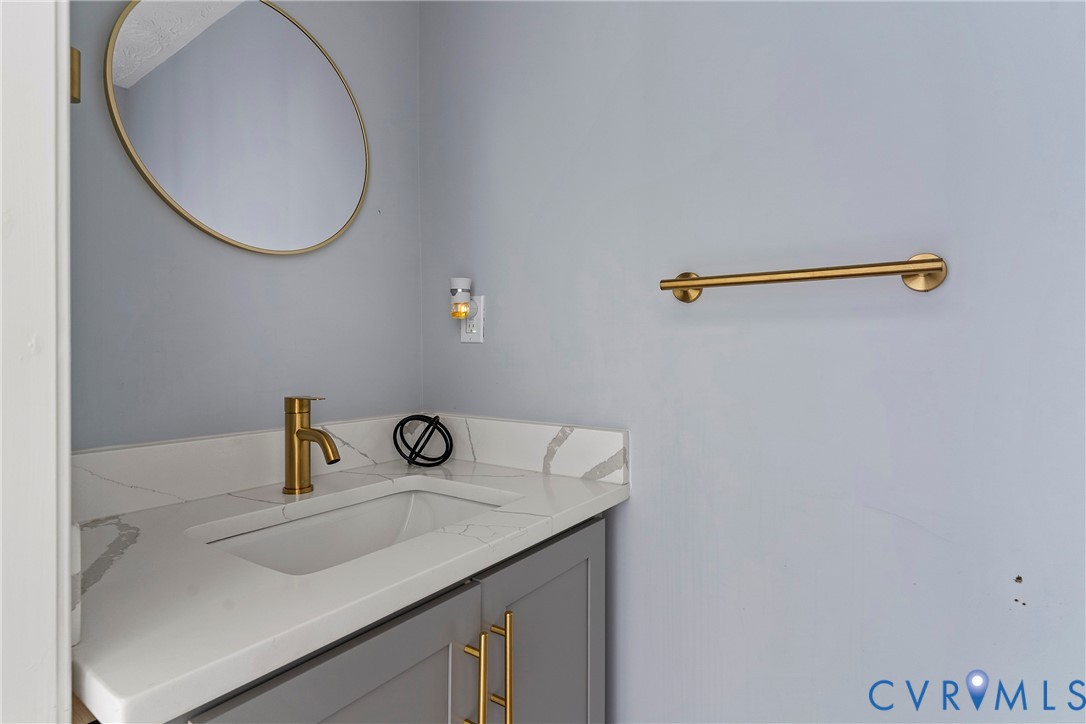 166 Wright Avenue Colonial Heights, VA 23834 - Photo 18 of 36 a bathroom with a sink and a mirror