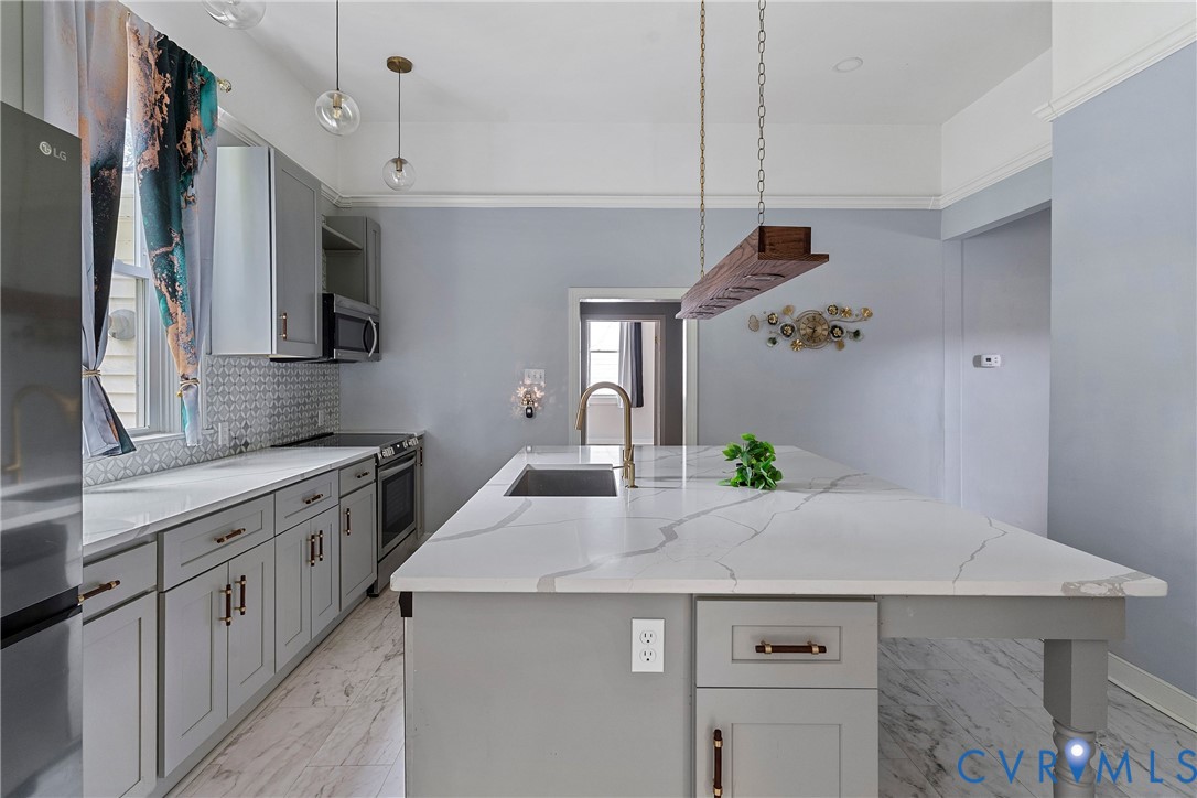 166 Wright Avenue Colonial Heights, VA 23834 - Photo 2 of 36 a kitchen with a sink a refrigerator and cabinets