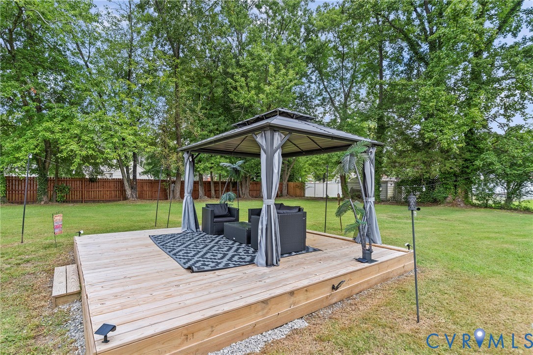 166 Wright Avenue Colonial Heights, VA 23834 - Photo 28 of 36 a view of a wooden deck with a yard