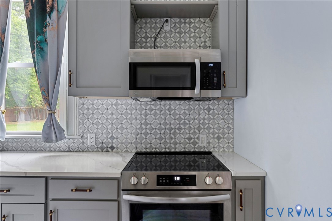 166 Wright Avenue Colonial Heights, VA 23834 - Photo 4 of 36 a stove top oven sitting inside of a kitchen