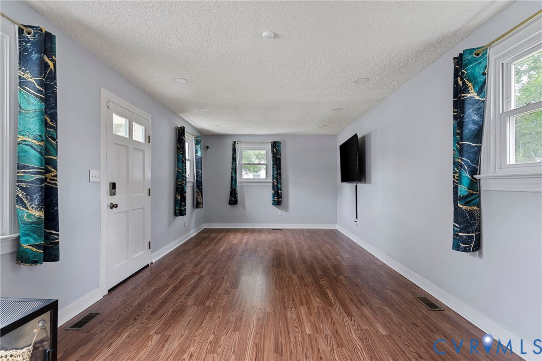 166 Wright Avenue Colonial Heights, VA 23834 - Photo 7 of 36 a view of empty room with wooden floor and fan
