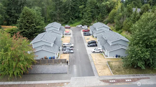 an aerial view of residential houses with outdoor space