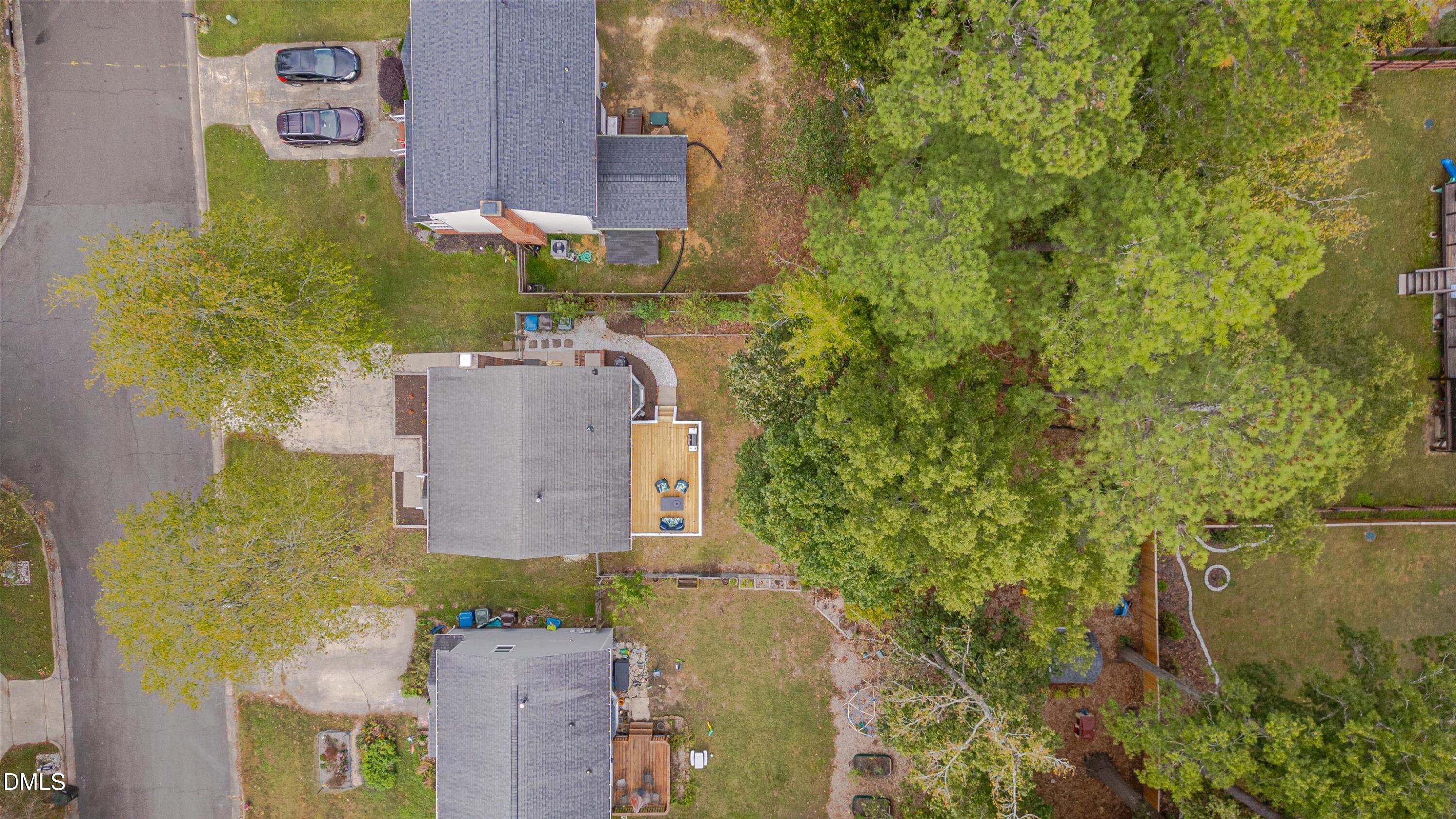 3301 Lassiter Street Durham, NC 27707 - Photo 29 of 32 aerial view of a house with a yard and large trees
