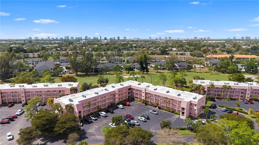 Aerial view of apartment complex and skyline