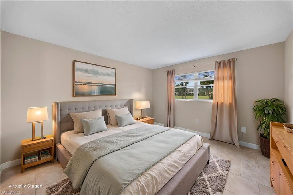 170 Turtle Lake Court, Unit 109 Naples, FL 34105 - Photo 5 of 19 Bedroom with baseboards