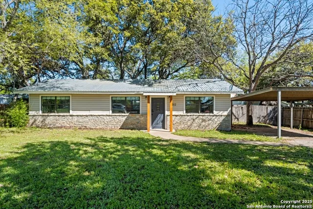 front view of a house with a yard