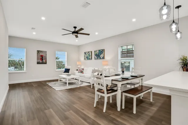 a view of a dining room with furniture window and wooden floor
