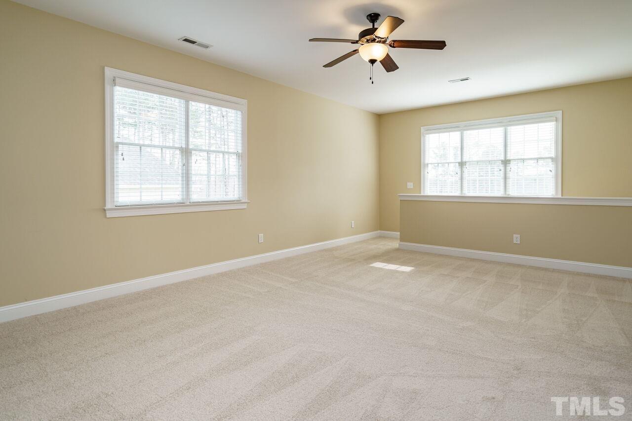 5327 Landguard Drive Raleigh, NC 27613 - Photo 33 of 45 wooden floor in an empty room with a window