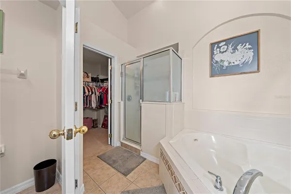 a bathroom with a sink a mirror and a bathtub