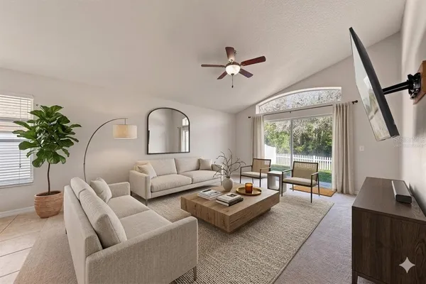 a living room with furniture and a potted plant
