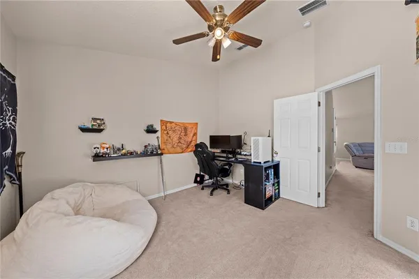 a bathroom with a granite countertop sink a toilet and a mirror