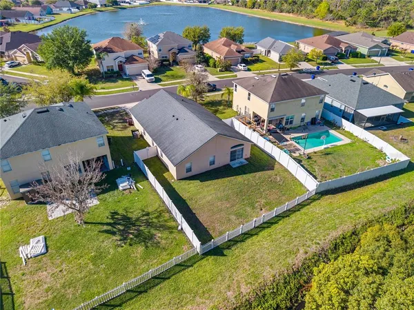 an aerial view of houses and yard