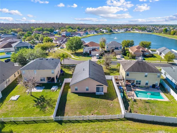 a view of a house with a yard and plants