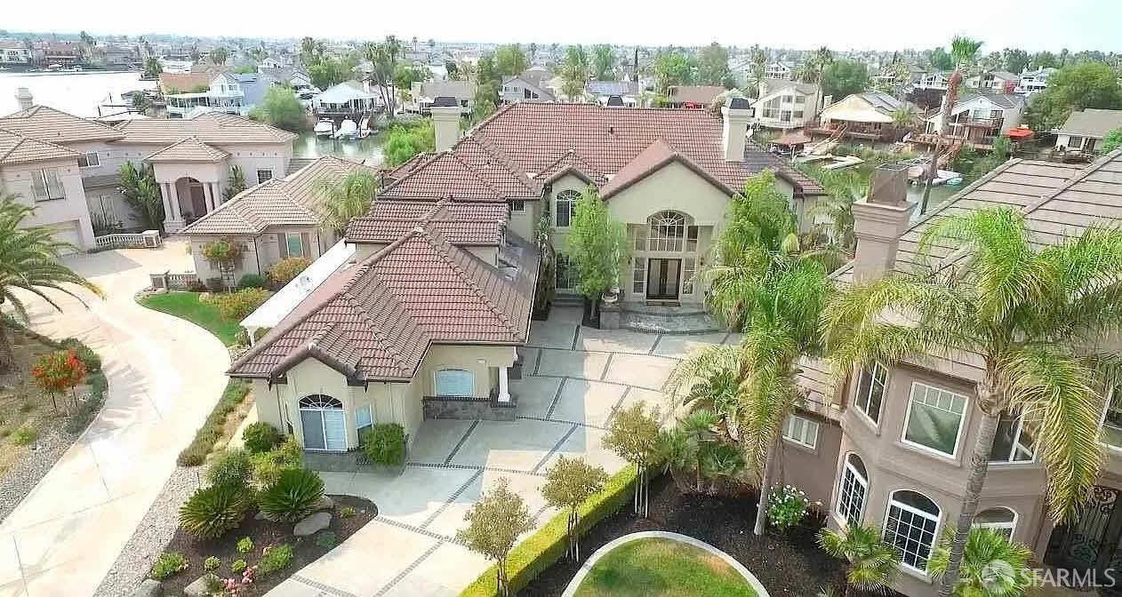 a aerial view of multiple houses with a big yard