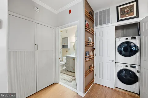a view of a bedroom with washer and dryer