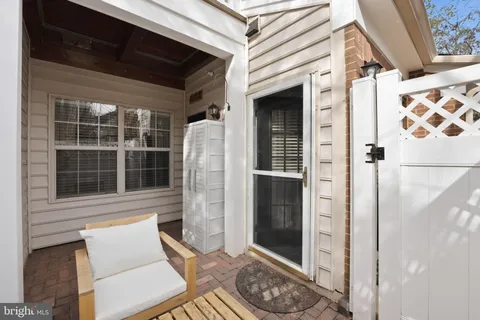 a view of a door and chair in the balcony