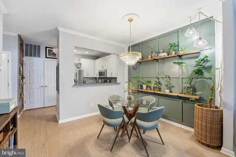 a living room with furniture fireplace and a view of kitchen