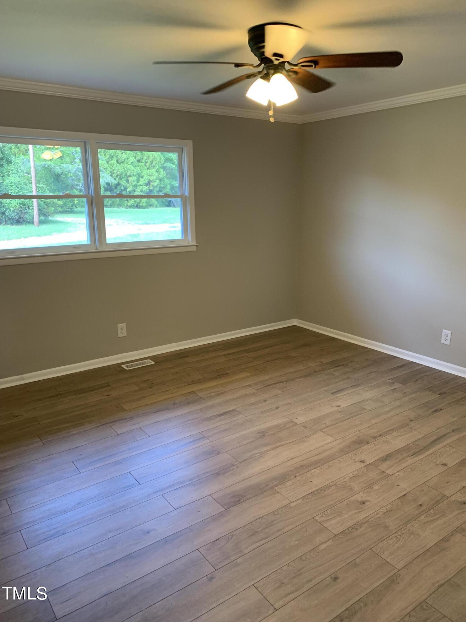 182 Old Lystra Road Chapel Hill, NC 27517 - Photo 10 of 17 a view of room with window and wooden floor