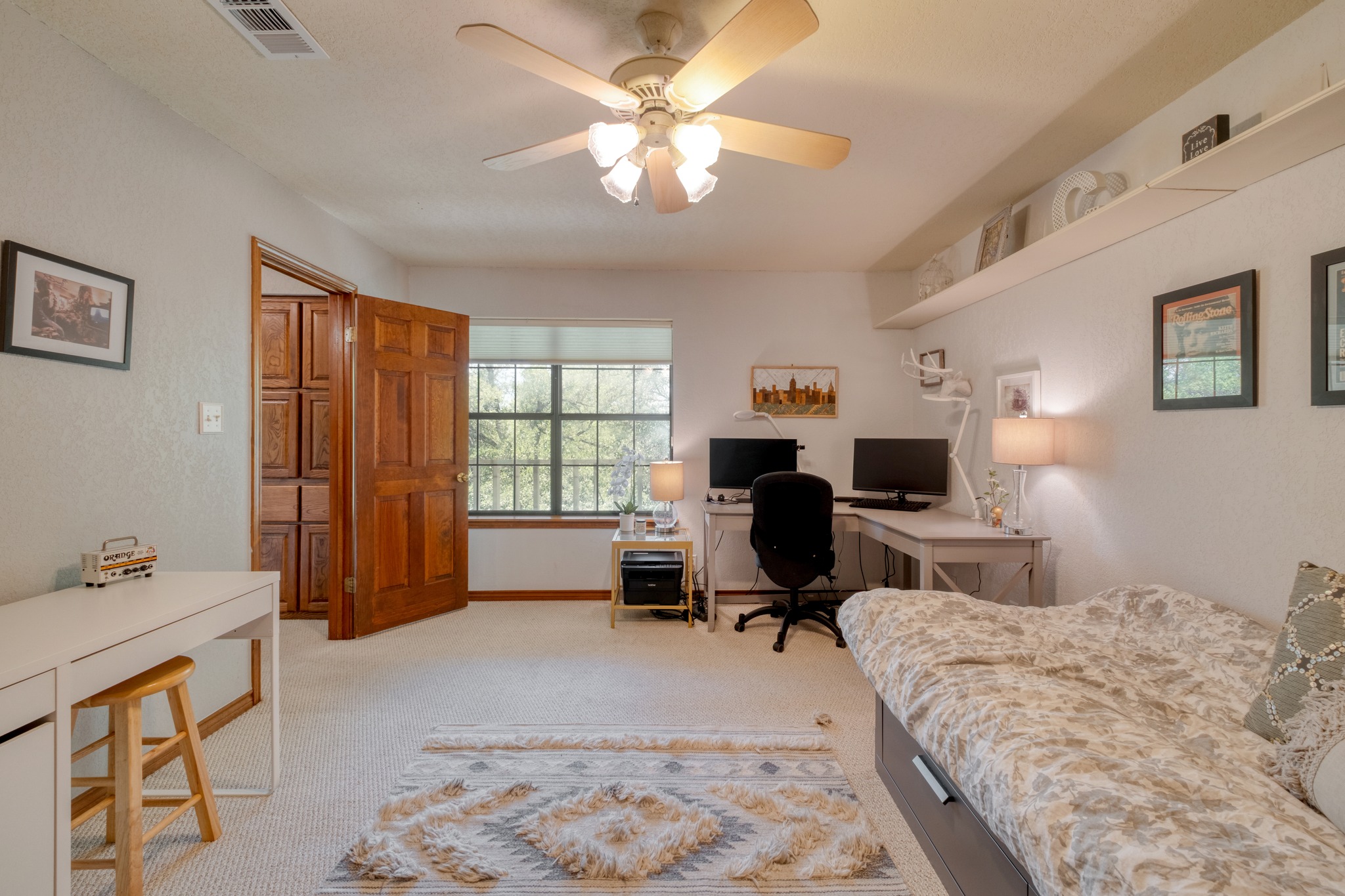 202 Ridgewood Drive Georgetown, TX 78628 - Photo 29 of 40 a bedroom that has a bed and a chair in it