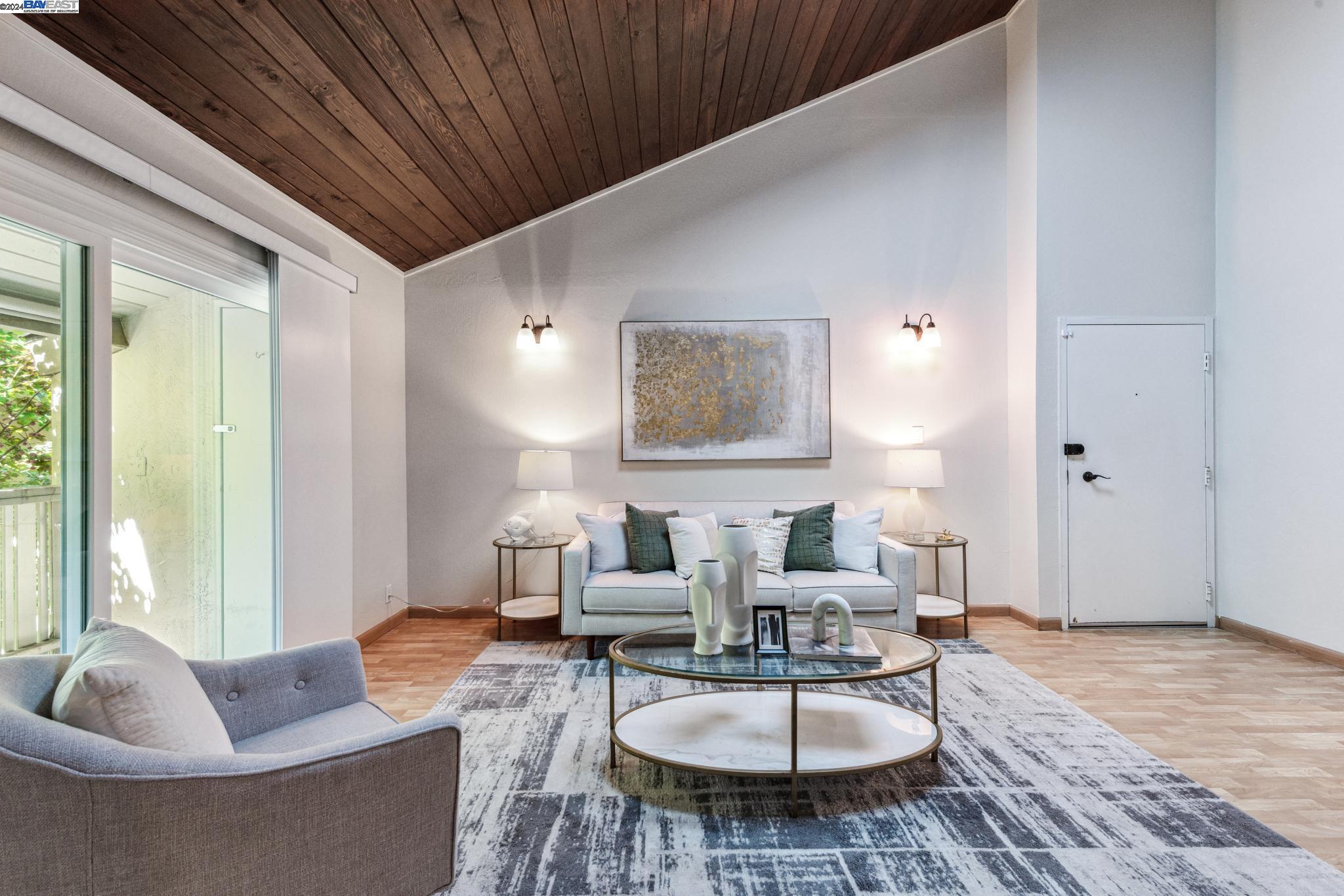 2724 Oak Road, Unit 119 Walnut Creek, CA 94597 - Photo 1 of 1 a living room with furniture and a table