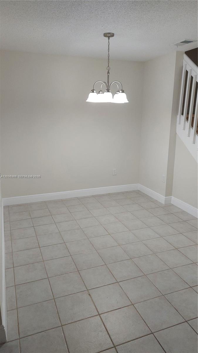 7083 Southwest 158th Court Miami, FL 33193 - Photo 3 of 22 a view of an empty room with a window