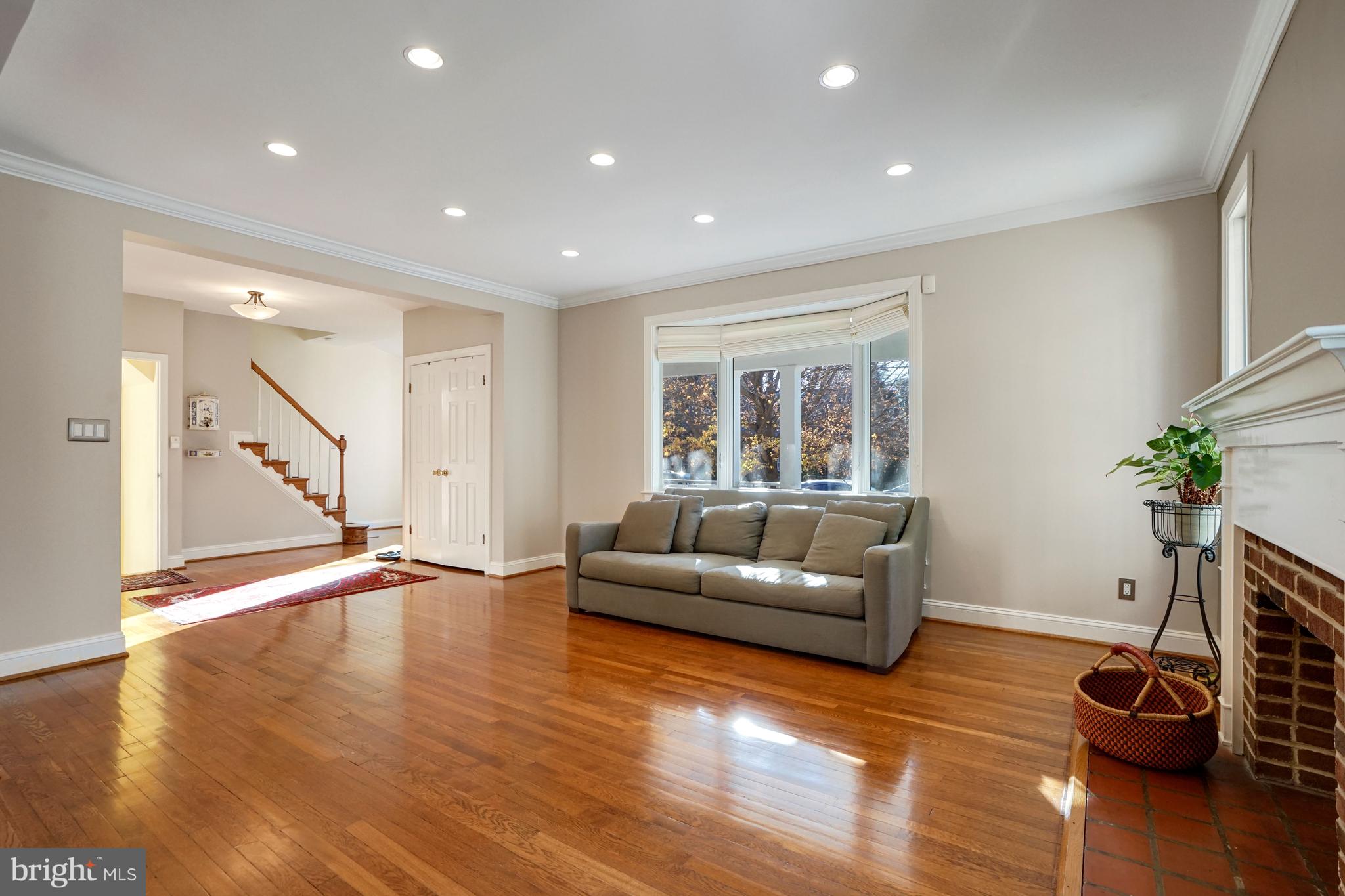 4407 Ridge Street Chevy Chase, MD 20815 - Photo 5 of 21 Sunny living room with the fire place