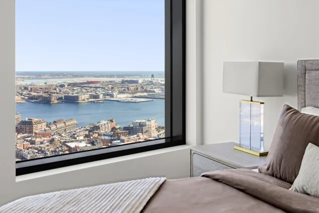 a living room with furniture and painting on the wall