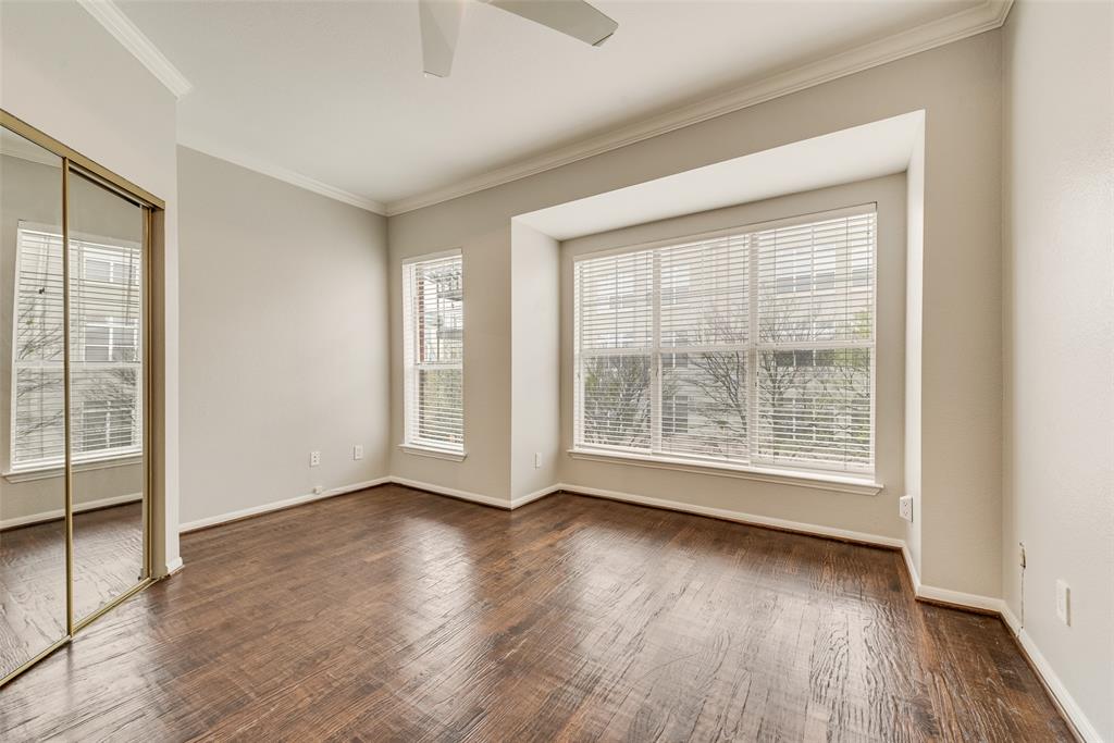 2902 State Street, Unit 1 Dallas, TX 75204 - Photo 15 of 24 an empty room with wooden floor and windows