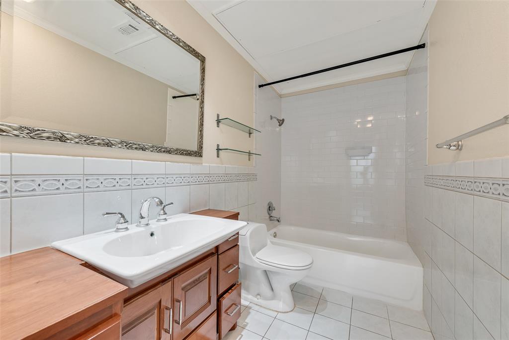 2902 State Street, Unit 1 Dallas, TX 75204 - Photo 16 of 24 a bathroom with a sink toilet and shower
