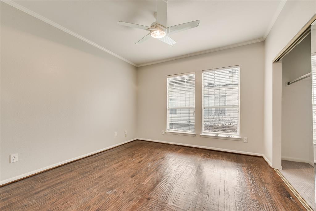 2902 State Street, Unit 1 Dallas, TX 75204 - Photo 17 of 24 an empty room with wooden floor and windows