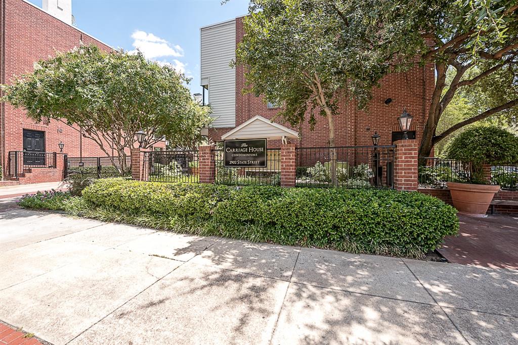 2902 State Street, Unit 1 Dallas, TX 75204 - Photo 2 of 24 a front view of a house with a yard and potted plants