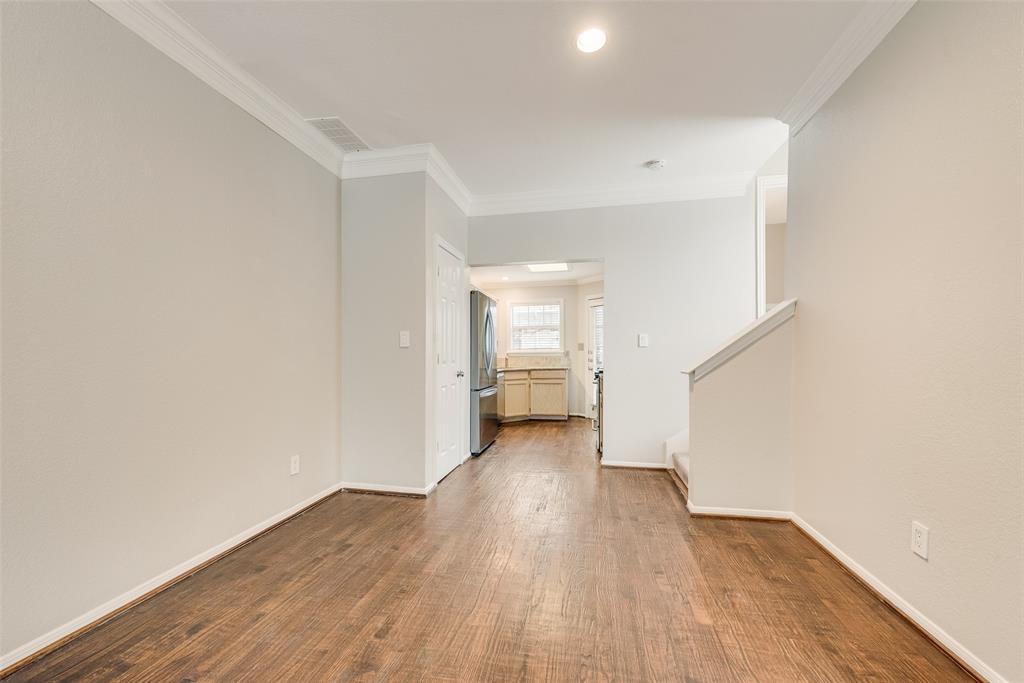 2902 State Street, Unit 1 Dallas, TX 75204 - Photo 7 of 24 a view of a big room with wooden floor and a bathroom