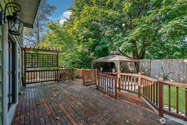 a view of a house with backyard sitting area and garden