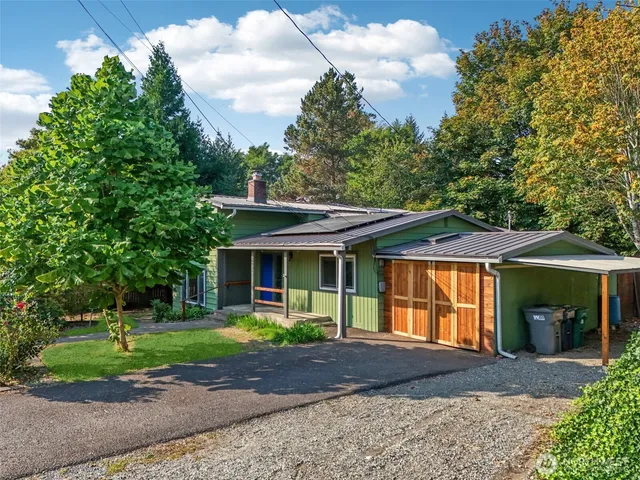an aerial view of multiple houses with yard