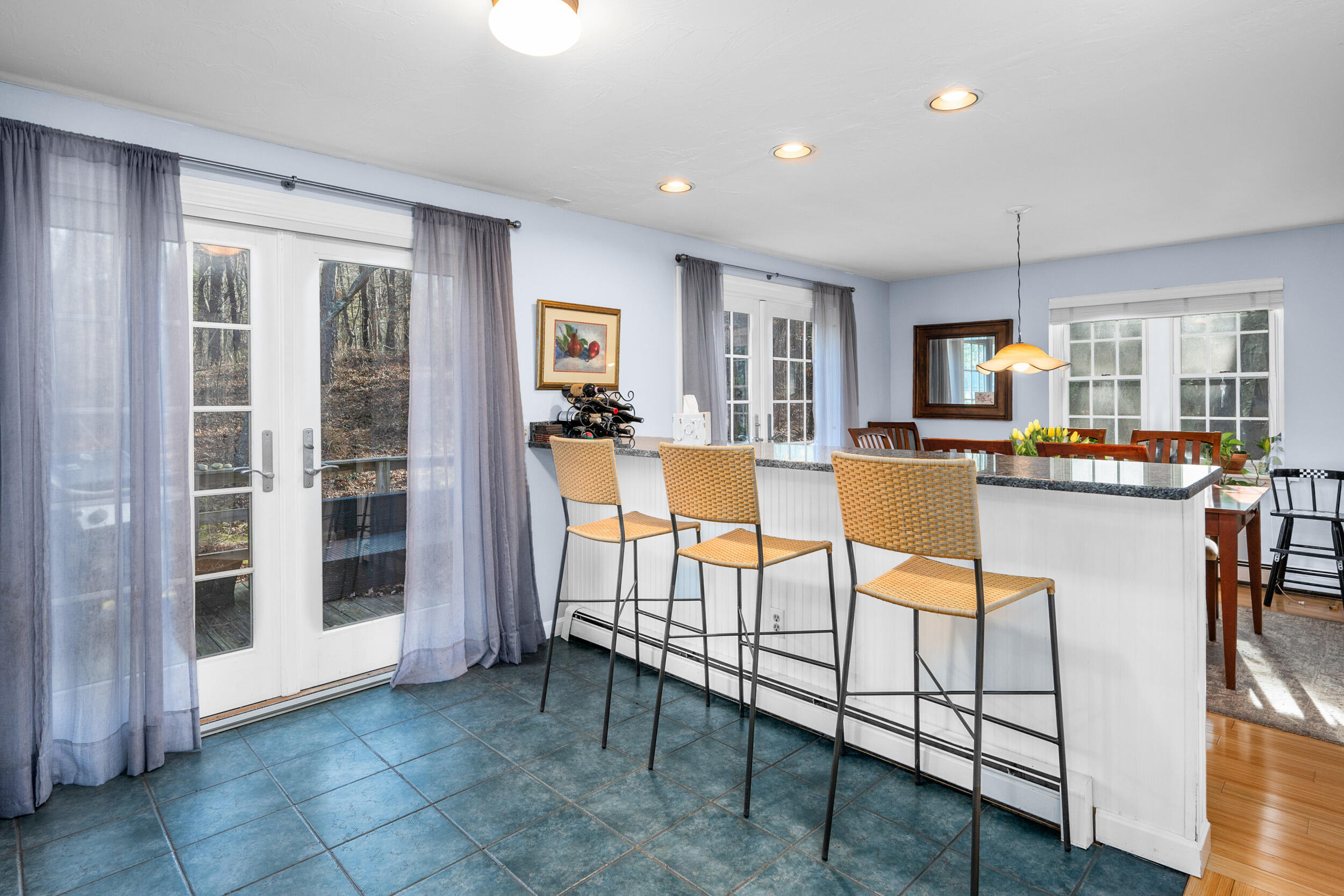 17 Briar Patch Road Osterville, MA 02655 - Photo 15 of 30 a living room with furniture a flat screen tv and a kitchen view