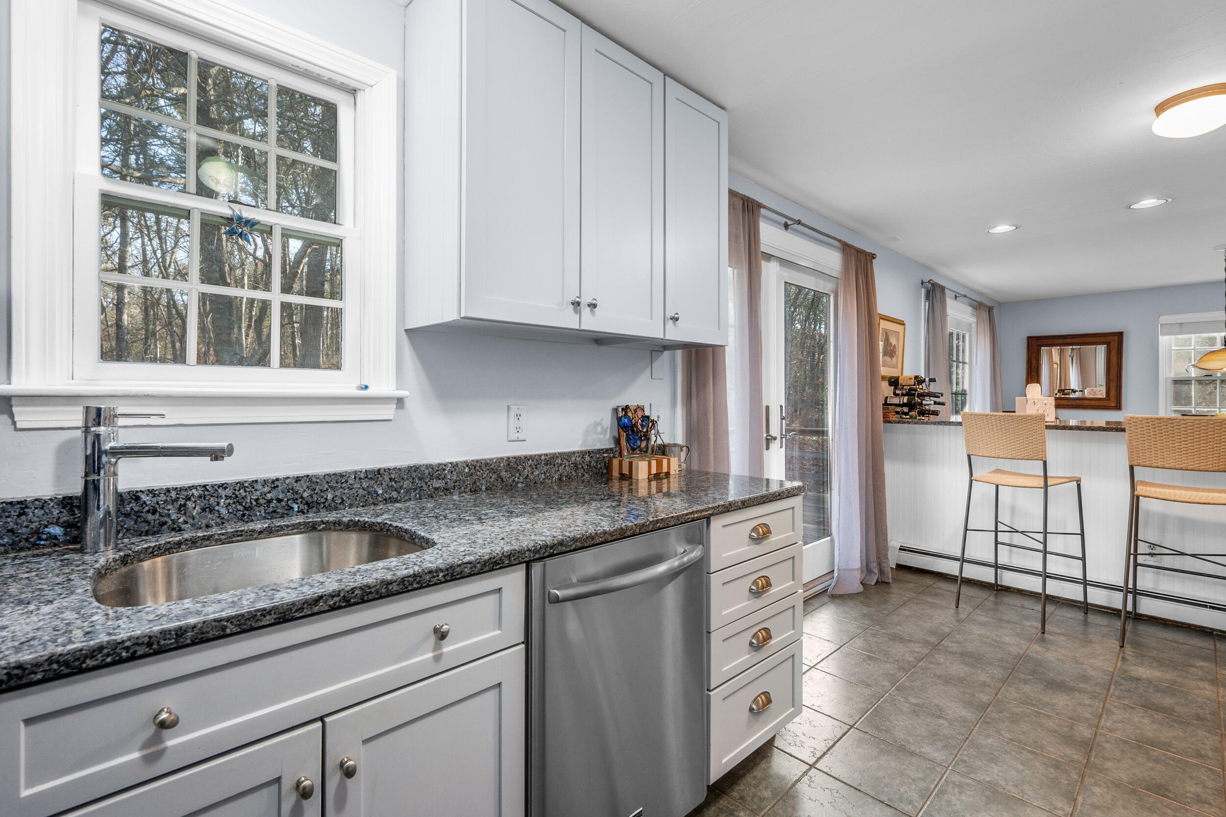 17 Briar Patch Road Osterville, MA 02655 - Photo 16 of 30 a kitchen with granite countertop a sink white cabinets and stainless steel appliances