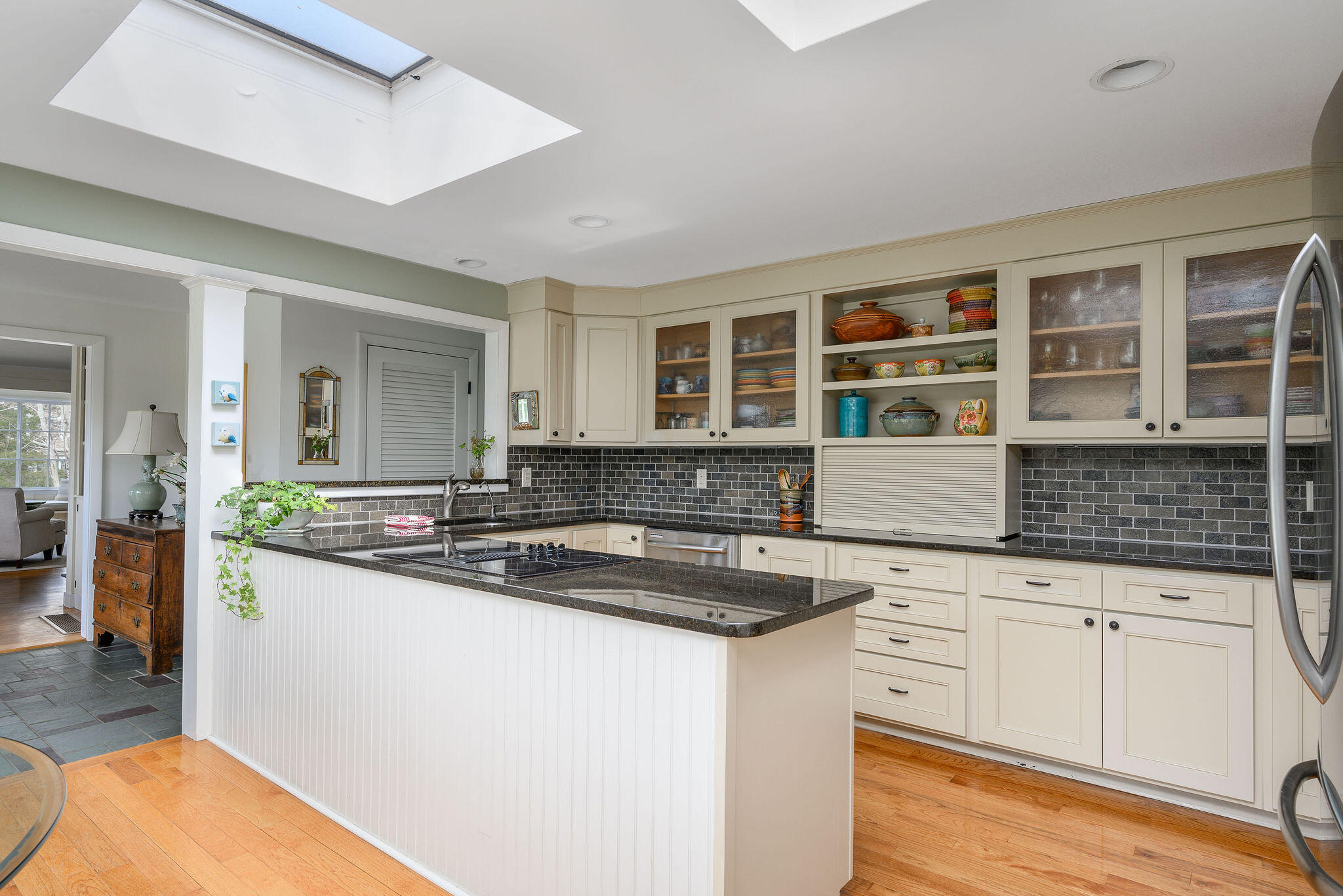 26 Beale Way Barnstable, MA 02630 - Photo 17 of 64 a kitchen with granite countertop a sink and cabinets
