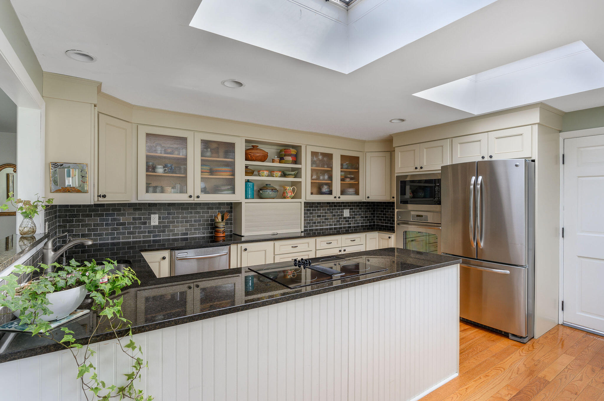26 Beale Way Barnstable, MA 02630 - Photo 19 of 64 a kitchen with stainless steel appliances granite countertop a refrigerator and a stove