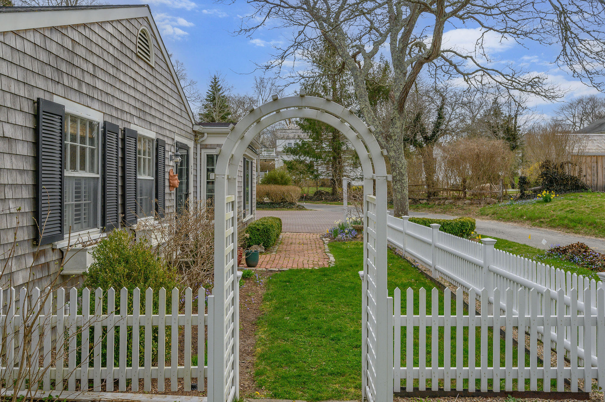 26 Beale Way Barnstable, MA 02630 - Photo 4 of 64 a view of a house with a small yard and a large tree
