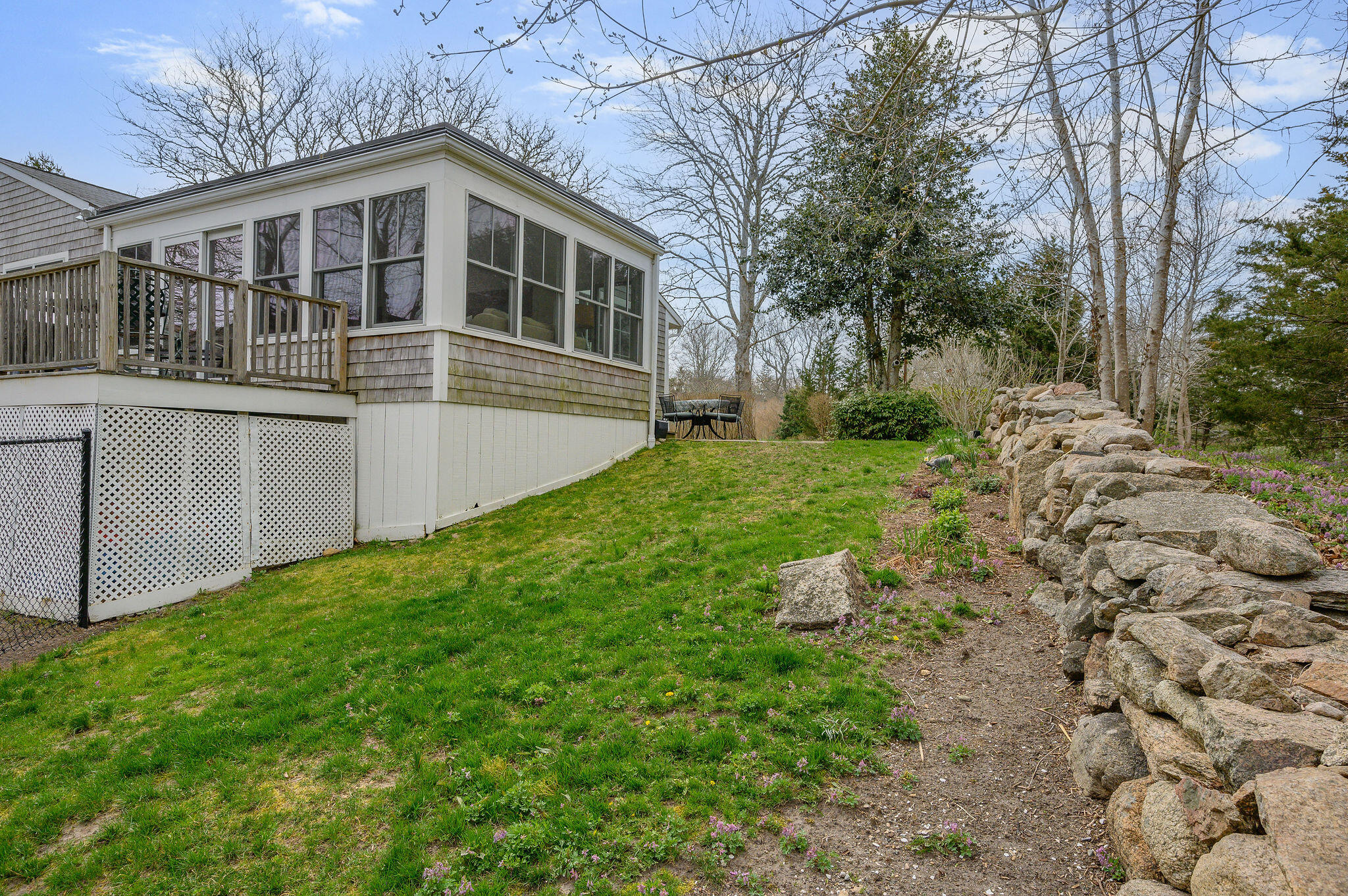 26 Beale Way Barnstable, MA 02630 - Photo 52 of 64 a front view of a house with yard and green space