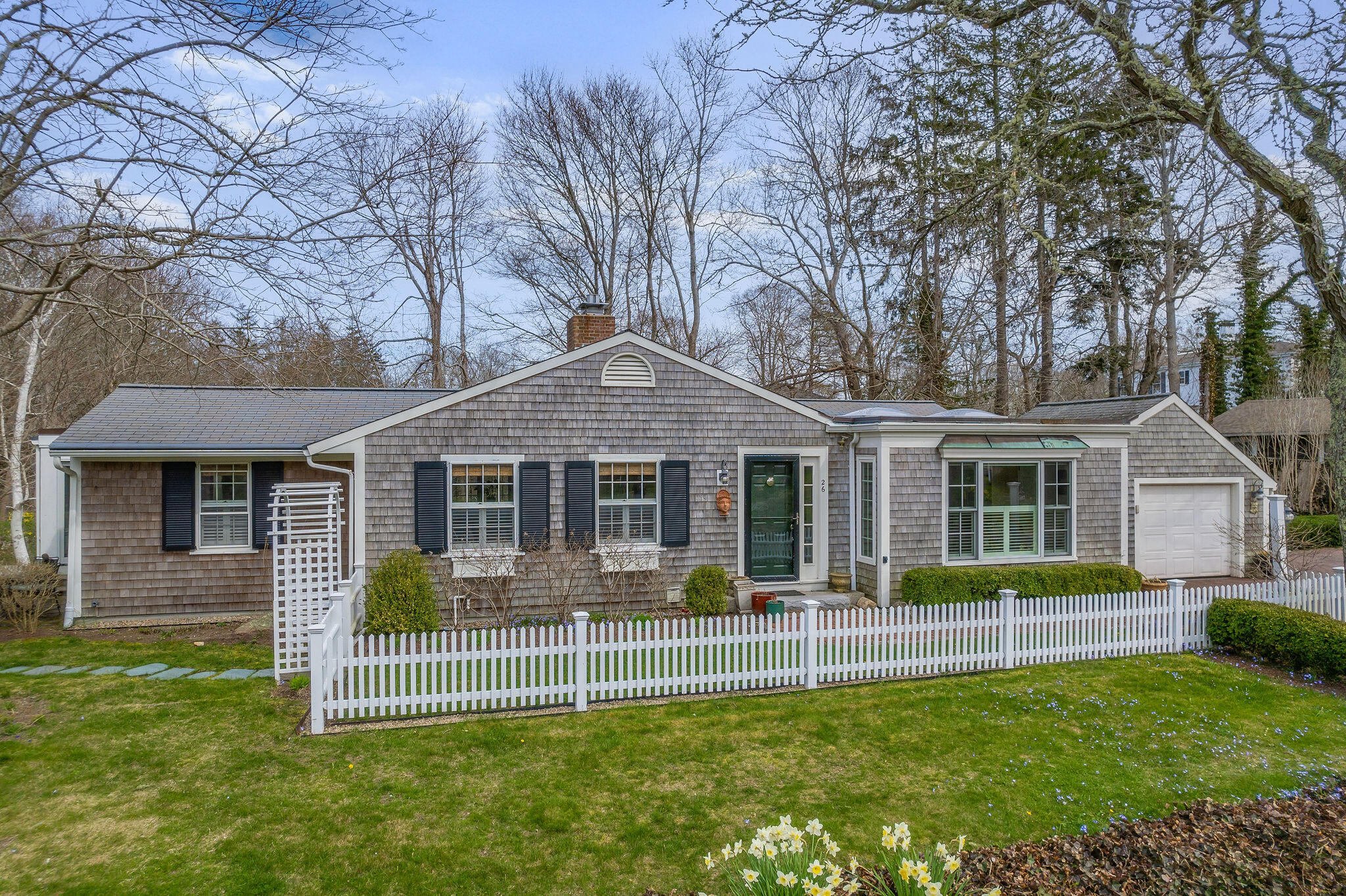 26 Beale Way Barnstable, MA 02630 - Photo 64 of 64 a front view of a house with a yard table and chairs