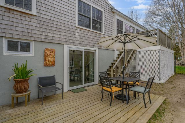 a living room with furniture a fireplace and a window